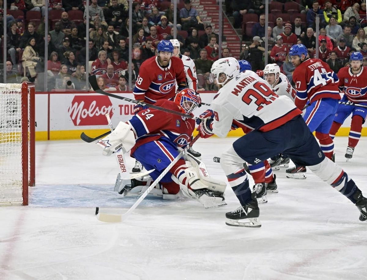Feb 17, 2024; Montreal, Quebec, CAN; Washington Capitals forward Anthony Mantha (39) scores a goal against Montreal Canadiens goalie Jake Allen (34) during the first period at the Bell Centre.