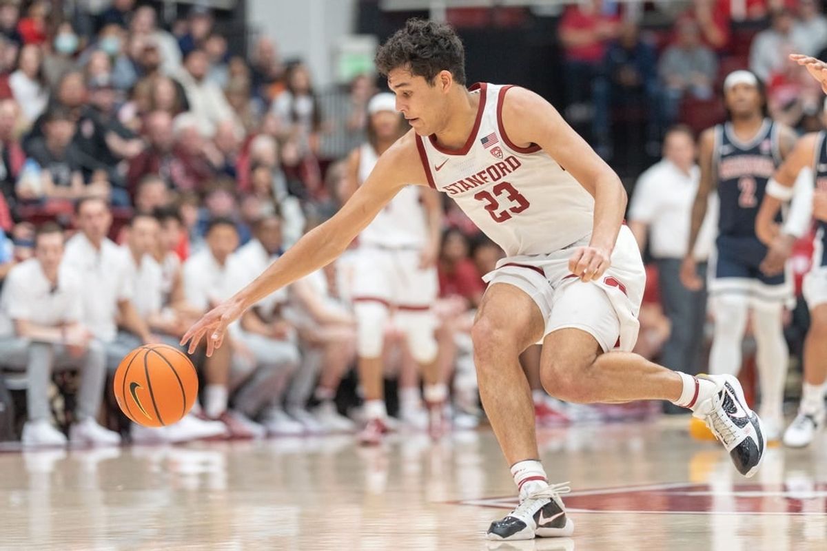Dec 31, 2023; Stanford, California, USA; Stanford Cardinal forward Brandon Angel (23) reaches for the ball during the second half against the Arizona Wildcats at Maples Pavilion.