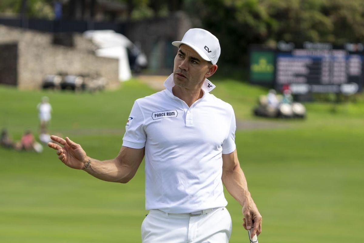 January 4, 2024; Maui, Hawaii, USA; Camilo Villegas acknowledges the crowd after making his putt on the 18th hole during the first round of The Sentry golf tournament at Kapalua Golf - The Plantation Course.