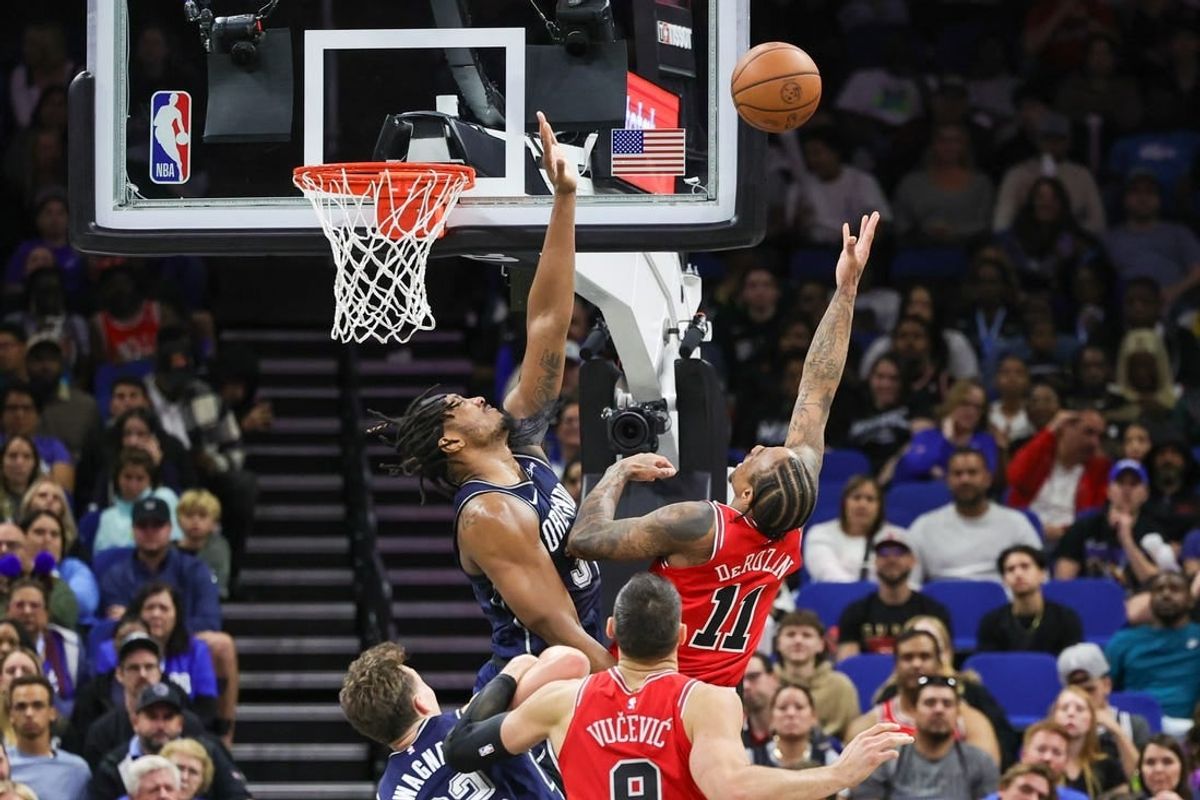 Feb 10, 2024; Orlando, Florida, USA; Chicago Bulls forward DeMar DeRozan (11) goes to the basket against Orlando Magic center Wendell Carter Jr. (34) during the second quarter at KIA Center.