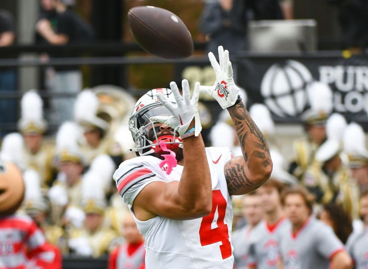 Oct 14, 2023; West Lafayette, Indiana, USA;  Ohio State Buckeyes wide receiver Julian Fleming (4) catches a pass during warmups prior to the game at Ross-Ade Stadium.