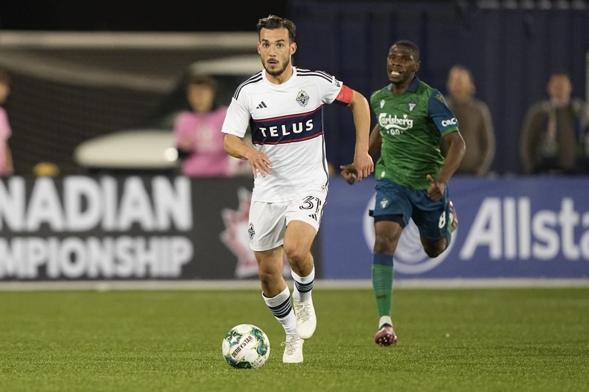 May 10, 2023; Toronto, Ontario, CAN; Vancouver Whitecaps midfielder Russell Teibert (31) dribbles the ball downfield against York United  during the second half at York Lions Stadium.