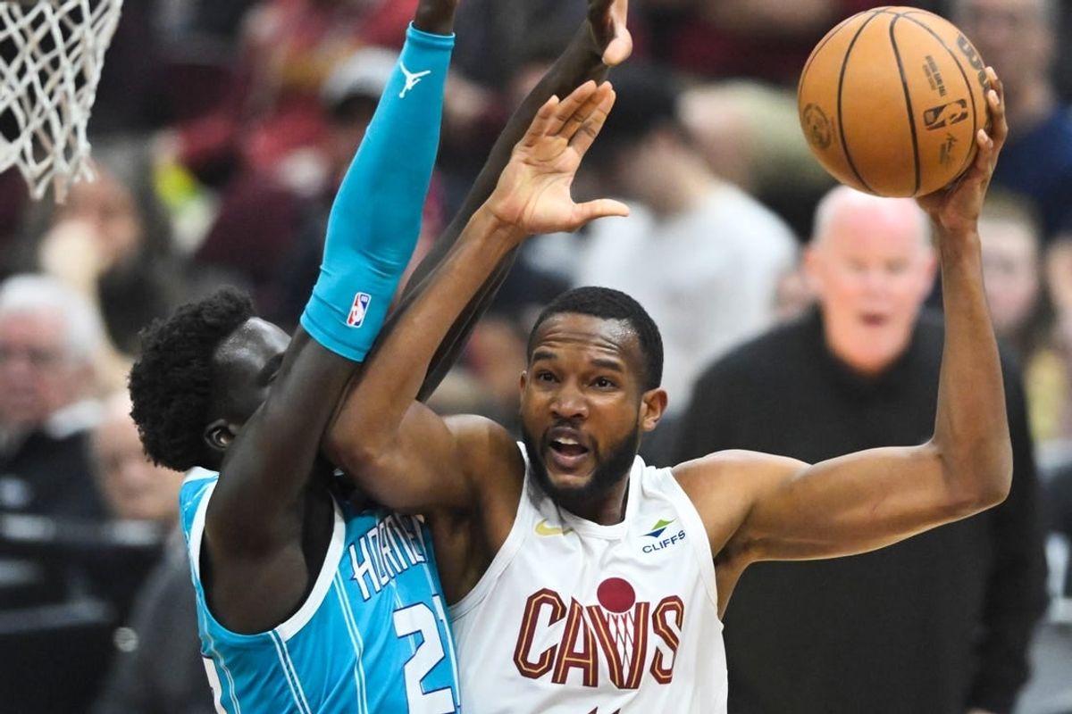 Apr 14, 2024; Cleveland, Ohio, USA; Charlotte Hornets forward JT Thor (21) defends Cleveland Cavaliers forward Evan Mobley (4) in the first quarter at Rocket Mortgage FieldHouse.