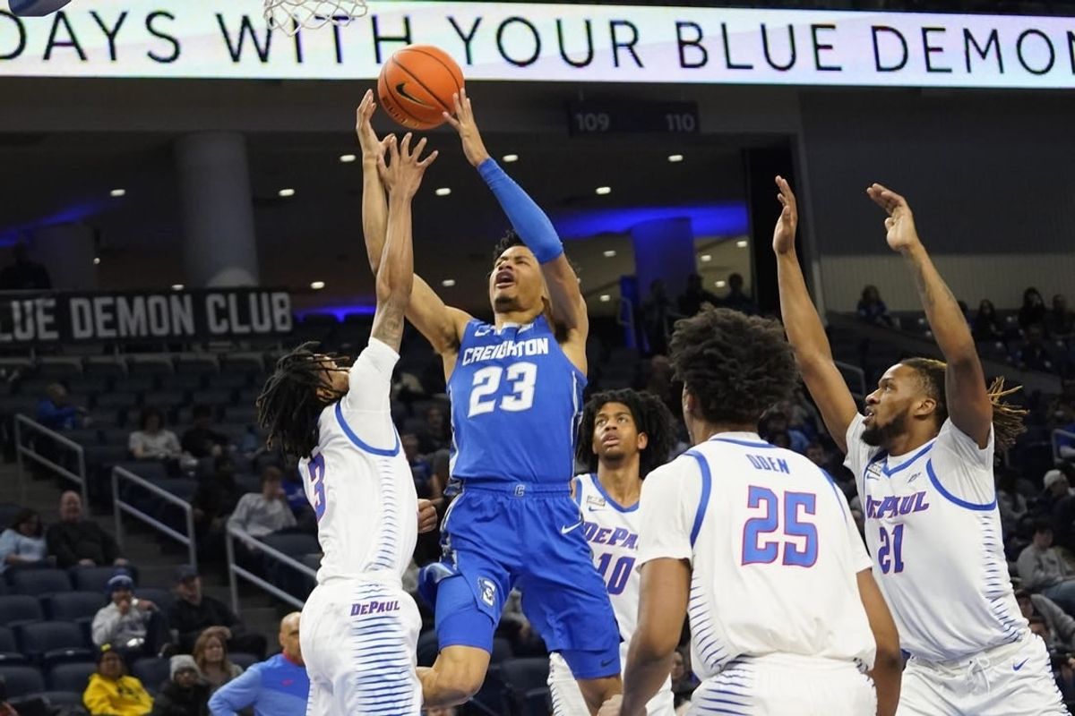 Jan 9, 2024; Chicago, Illinois, USA; DePaul Blue Demons guard Jalen Terry (3) defends Creighton Bluejays guard Trey Alexander (23) during the first half at Wintrust Arena.