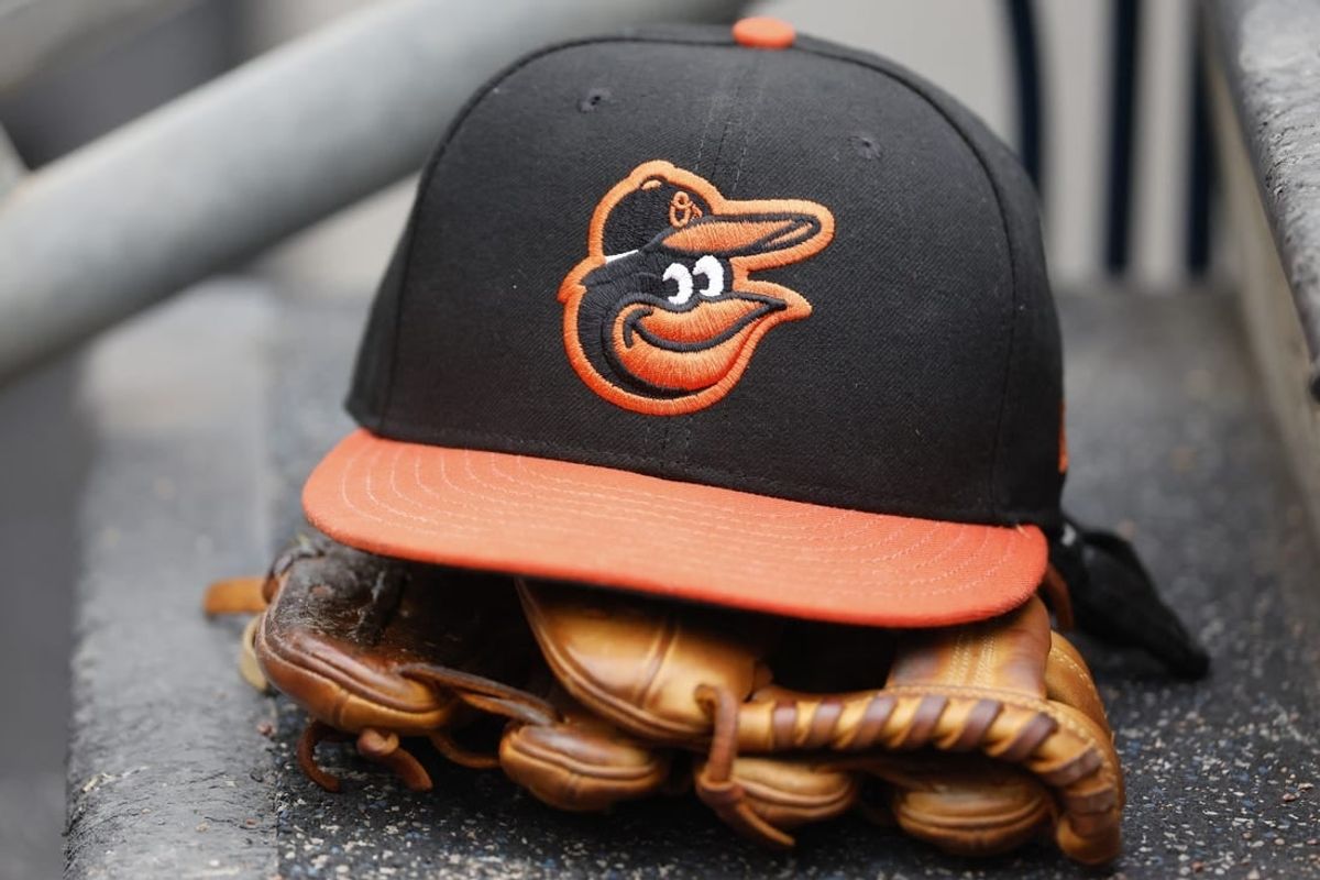 May 14, 2022; Detroit, Michigan, USA;  Baltimore Orioles cap and glove sits in dugout in the second inning against the Detroit Tigers at Comerica Park.