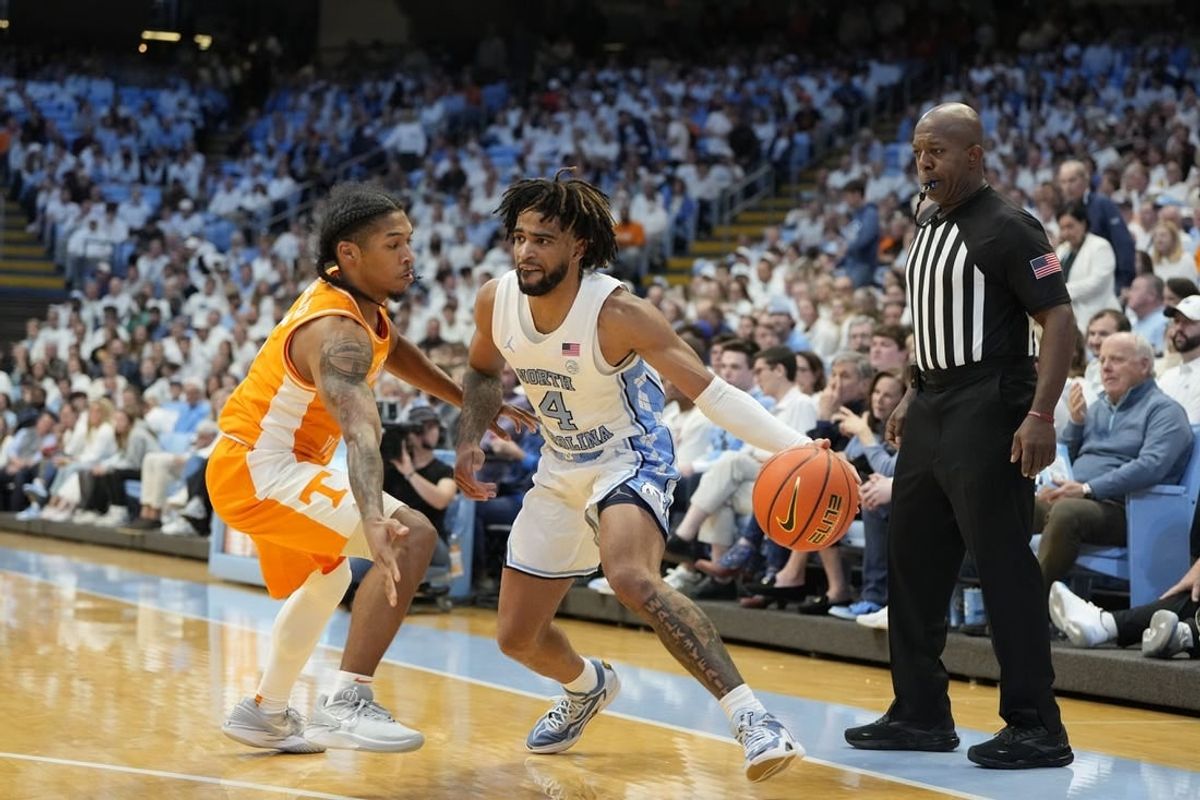 Nov 29, 2023; Chapel Hill, North Carolina, USA; North Carolina Tar Heels guard RJ Davis (4) with the ball as Tennessee Volunteers guard Zakai Zeigler (5) defends in the second half at Dean E. Smith Center.