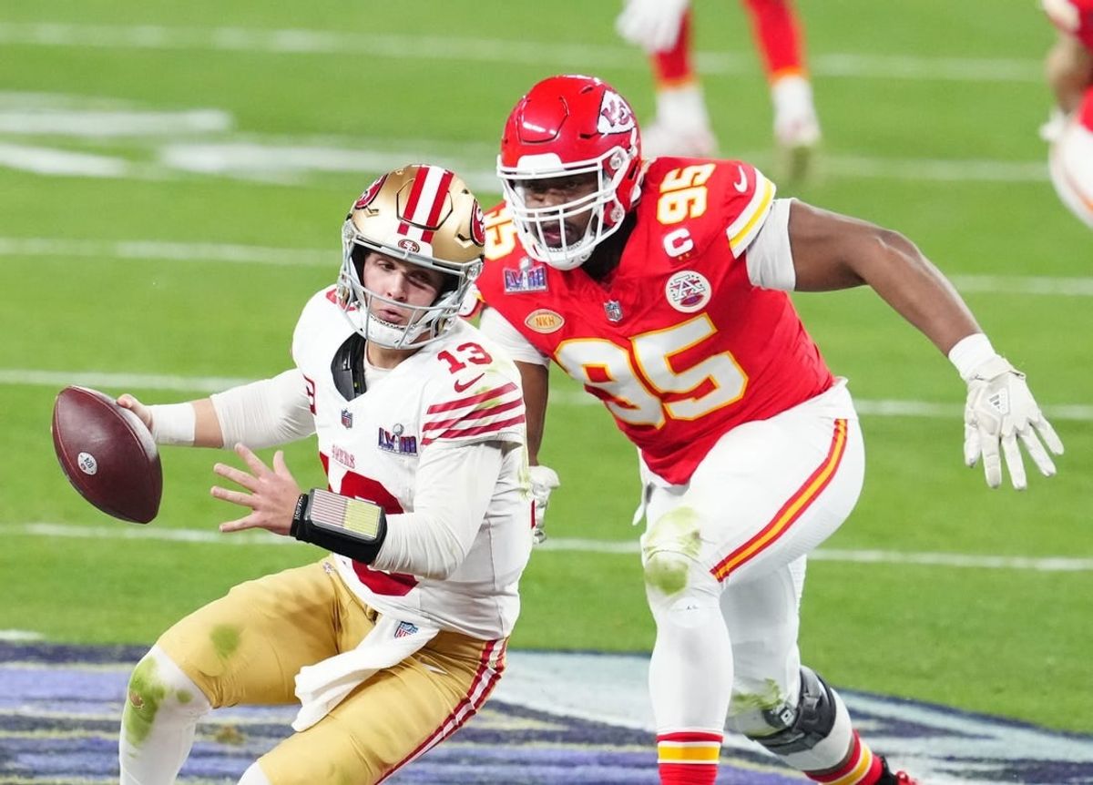 Feb 11, 2024; Paradise, Nevada, USA; San Francisco 49ers quarterback Brock Purdy (13) is pressured by Kansas City Chiefs defensive tackle Chris Jones (95) in the second half in Super Bowl LVIII at Allegiant Stadium.