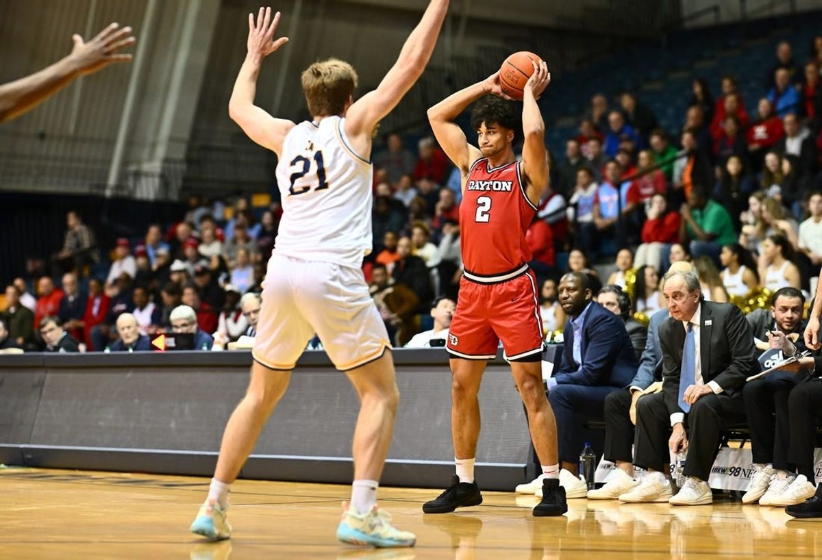 Jan 23, 2024; Philadelphia, Pennsylvania, USA; Dayton Flyers forward Nate Santos (2) controls the ball against La Salle Explorers forward Ryan Zan (21) in the first half at Tom Gola Arena at TruMark Financial Center.