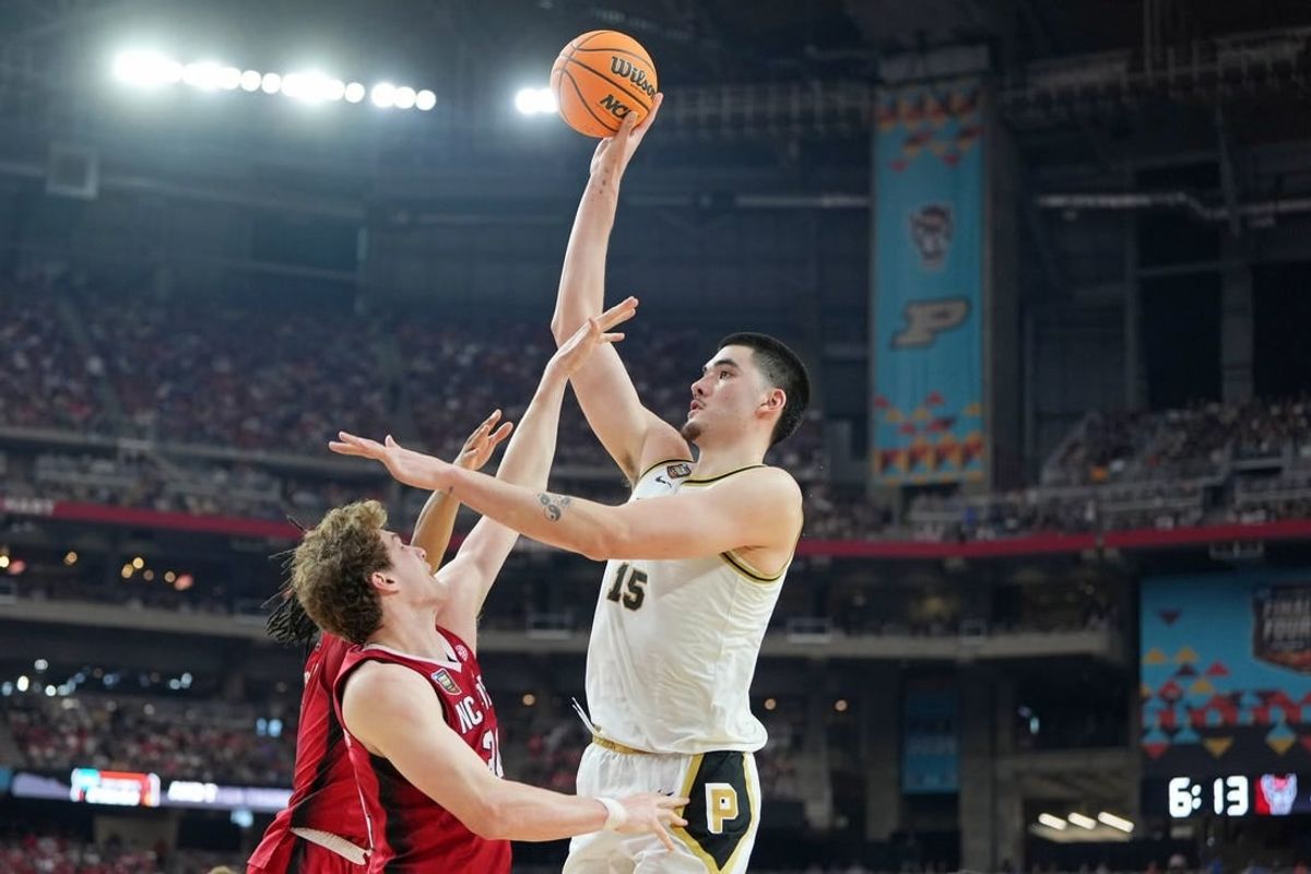 Apr 6, 2024; Glendale, AZ, USA; Purdue Boilermakers center Zach Edey (15) shoots the ball against North Carolina State Wolfpack forward Ben Middlebrooks (34) during the second half in the semifinals of the men's Final Four of the 2024 NCAA Tournament at State Farm Stadium.