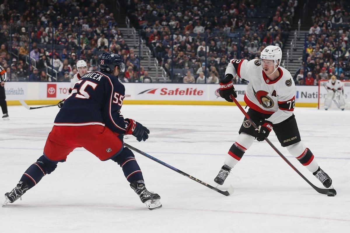 Dec 1, 2023; Columbus, Ohio, USA; Ottawa Senators defenseman Thomas Chabot (72) takes a shot as Columbus Blue Jackets defenseman David Jiricek (55) defends during the third period at Nationwide Arena.