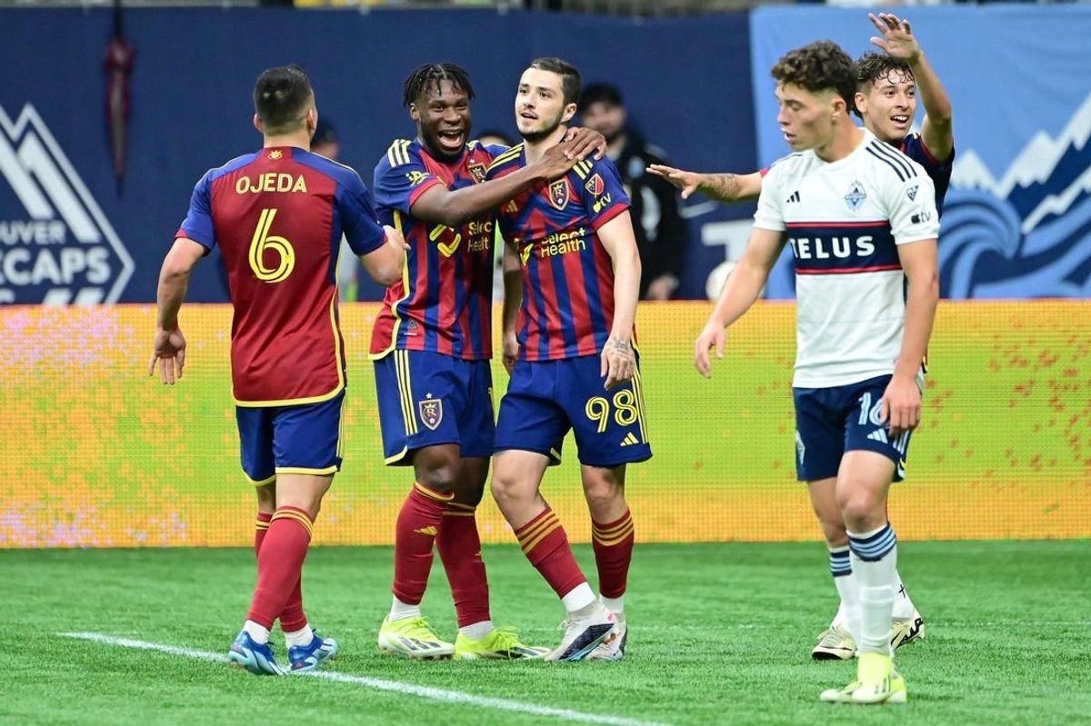 Mar 23, 2024; Vancouver, British Columbia, CAN; Real Salt Lake defender Alexandros Katranis (98) celebrates his second half goal against Vancouver Whitecaps FC with midfielders Emeka Eneli (14) and Braian Ojeda (6) at BC Place.
