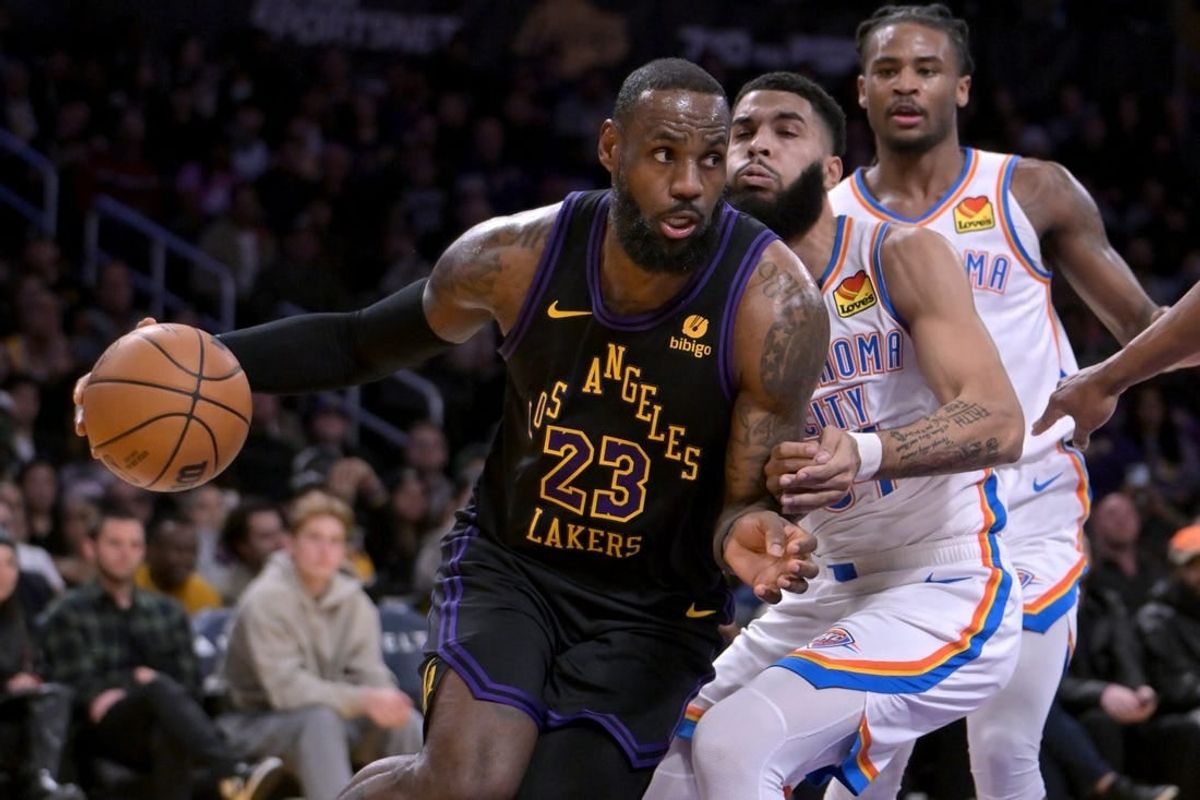 Jan 15, 2024; Los Angeles, California, USA;   Los Angeles Lakers forward LeBron James (23) drives past Oklahoma City Thunder guard Cason Wallace (22) in the first half at Crypto.com Arena.