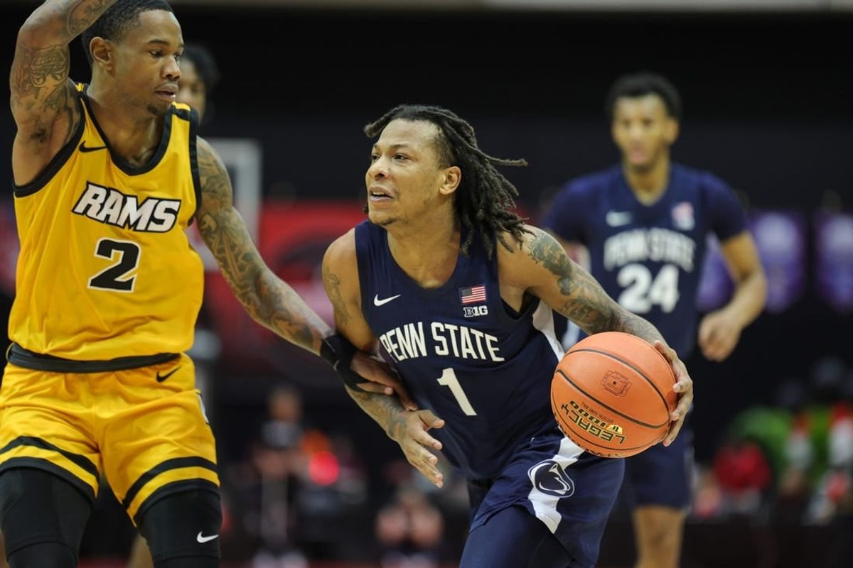 Nov 26, 2023; Kissimmee, FL, USA;  Penn State Nittany Lions guard Ace Baldwin Jr. (1) drives to the hoop past Virginia Commonwealth Rams guard Zeb Jackson (2) in the second half during the ESPN Invitational Events tournament seventh place game at State Farm Field House.