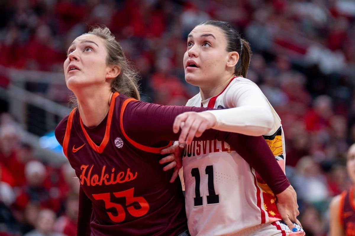 Virginia Tech center Elizabeth Kitley (33) fights for a rebound on Sunday, Feb. 18, 2024 at KFC YUM Center.