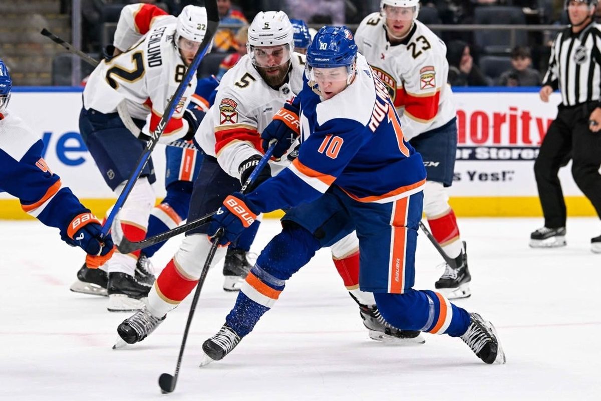 Jan 27, 2024; Elmont, New York, USA; New York Islanders right wing Simon Holmstrom (10) shoots and scores a goal against the Florida Panthers during the second period at UBS Arena.