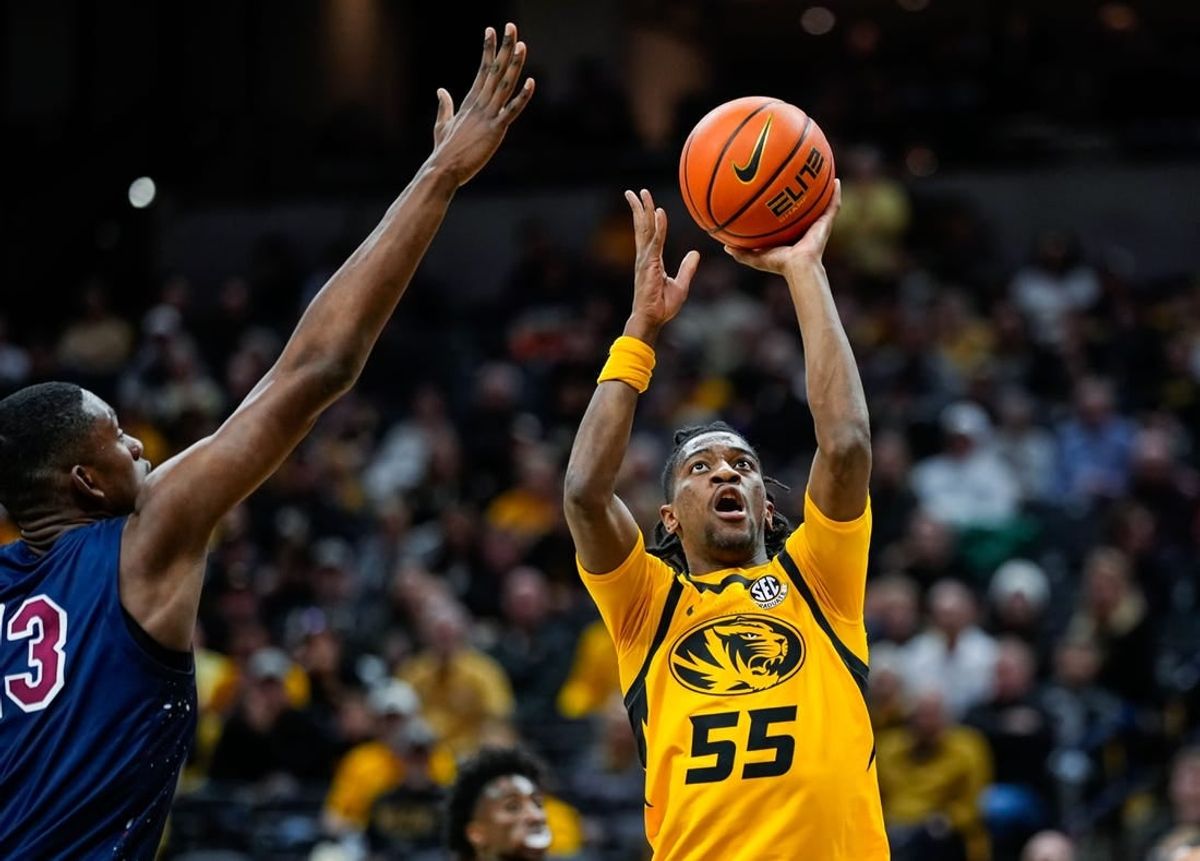 Nov 22, 2023; Columbia, Missouri, USA; Missouri Tigers guard Sean East II (55) shoots against South Carolina State Bulldogs center Drayton Jones (13) during the second half at Mizzou Arena.