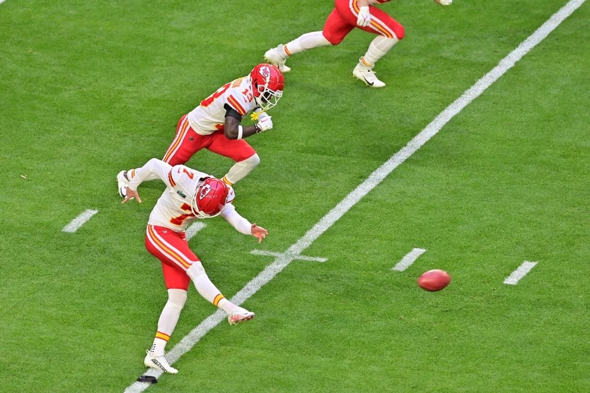 Feb 12, 2023; Glendale, Arizona, US; Kansas City Chiefs place kicker Harrison Butker (7) kicks off against the Philadelphia Eagles to start Super Bowl LVII at State Farm Stadium.
