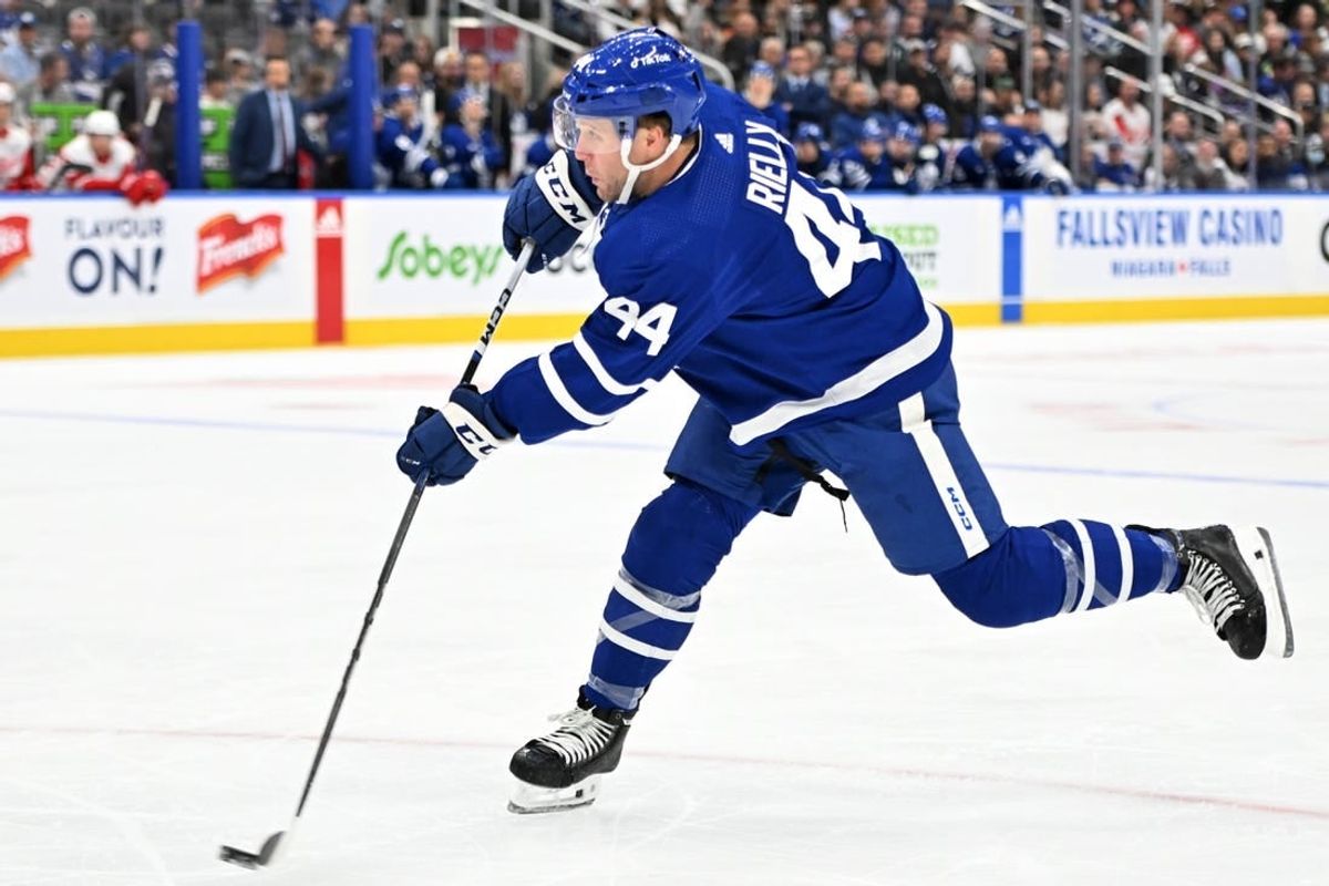 Oct 5, 2023; Toronto, Ontario, CAN; Toronto Maple Leafs defenseman Morgan Rielly (44) shoots the puck against the Detroit Red Wings in the first period at Scotiabank Arena.