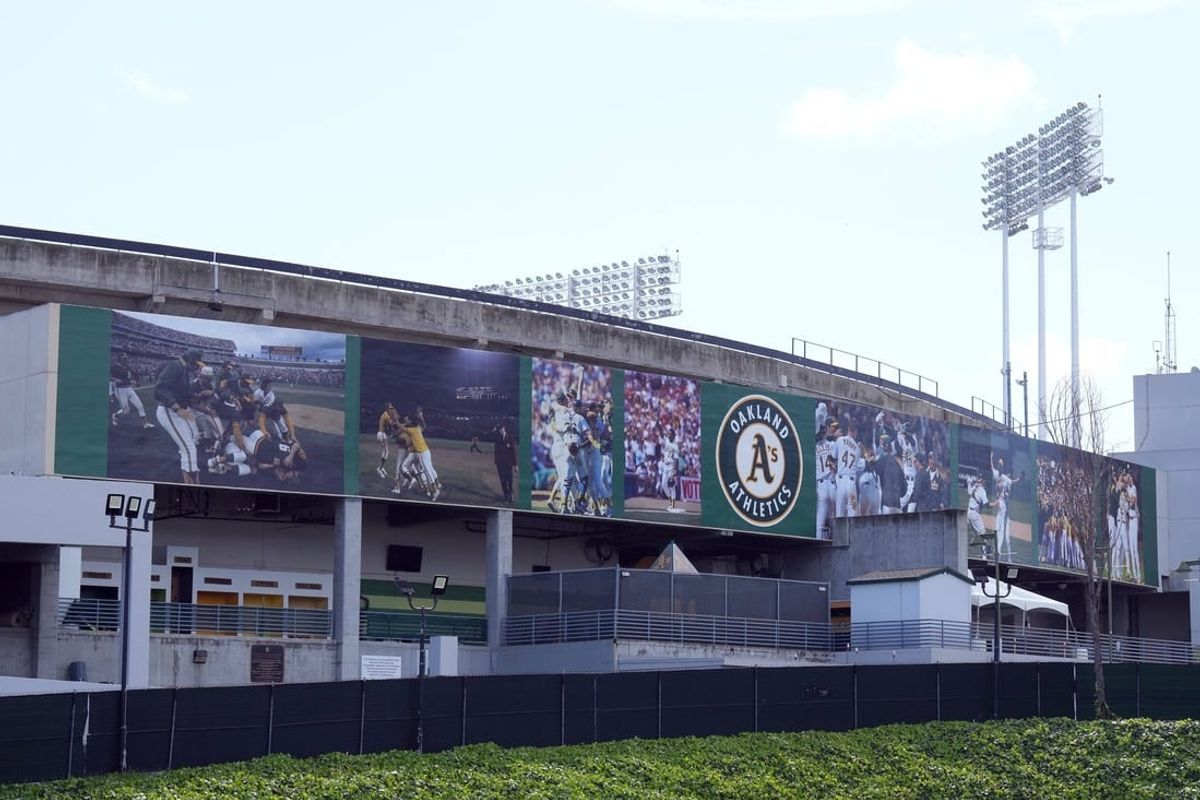 Mar 30, 2024; Oakland, California, USA; A mural on the outside of the stadium that replaced the Rooted in Oakland sign as seen before the game between the Oakland Athletics and the Cleveland Guardians at Oakland-Alameda County Coliseum.