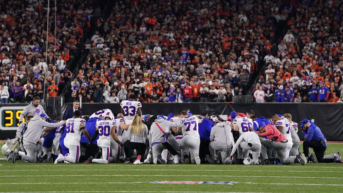 Bills players gather to pray after Damar Hamlin was taken to the hospital following receiving CPR.