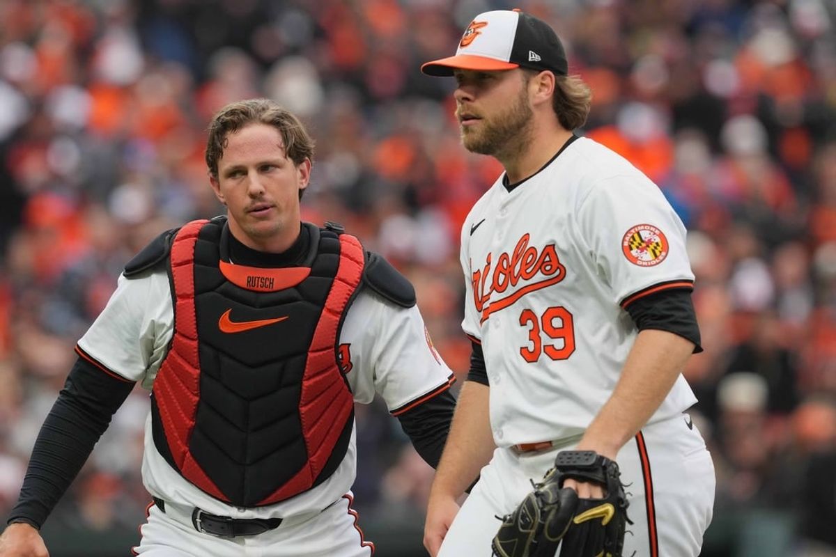 Mar 28, 2024; Baltimore, Maryland, USA; Baltimore Orioles pitcher Corbin Burnes (39) is greeted by catcher Adley Rutschman (35) after the second inning against the Los Angeles Angels at Oriole Park at Camden Yards.