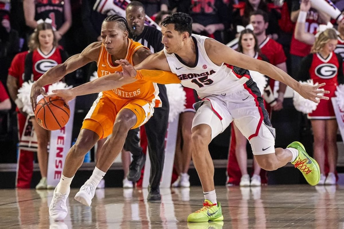 Jan 13, 2024; Athens, Georgia, USA; Tennessee Volunteers guard Jordan Gainey (2) and Georgia Bulldogs guard RJ Melendez (15) fight for the ball during the first half at Stegeman Coliseum.