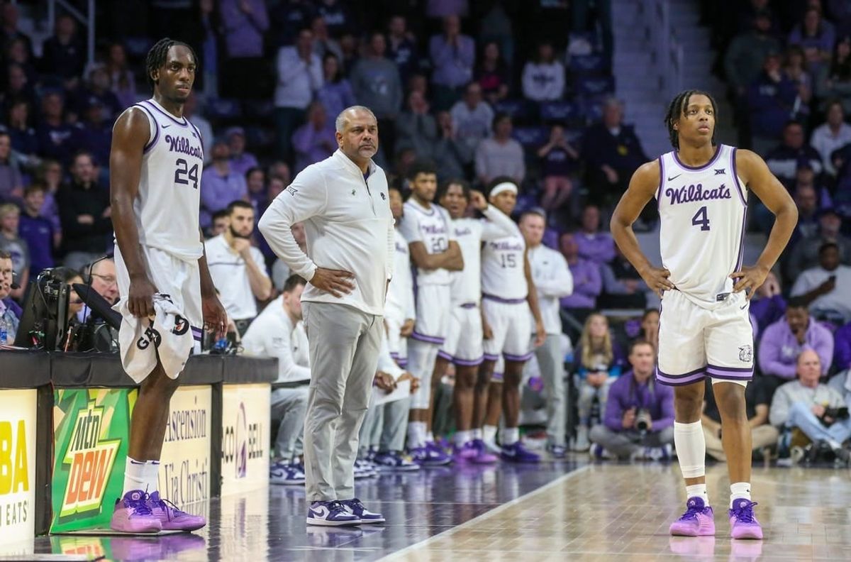 Feb 17, 2024; Manhattan, Kansas, USA; Kansas State Wildcats head coach Jerome Tang, forward Arthur Maluma (24) and guard Dai Dai Ames (4) watch as the TCU Horned Frogs shoots free throws during the second half at Bramlage Coliseum.