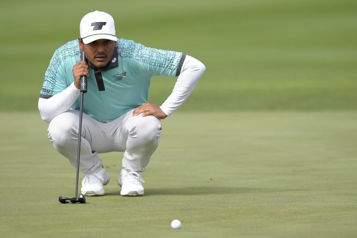 Sebastian Munoz lines up his putt on the 14th green during the first round of the LIV Golf Las Vegas tournament at Las Vegas Country Club.