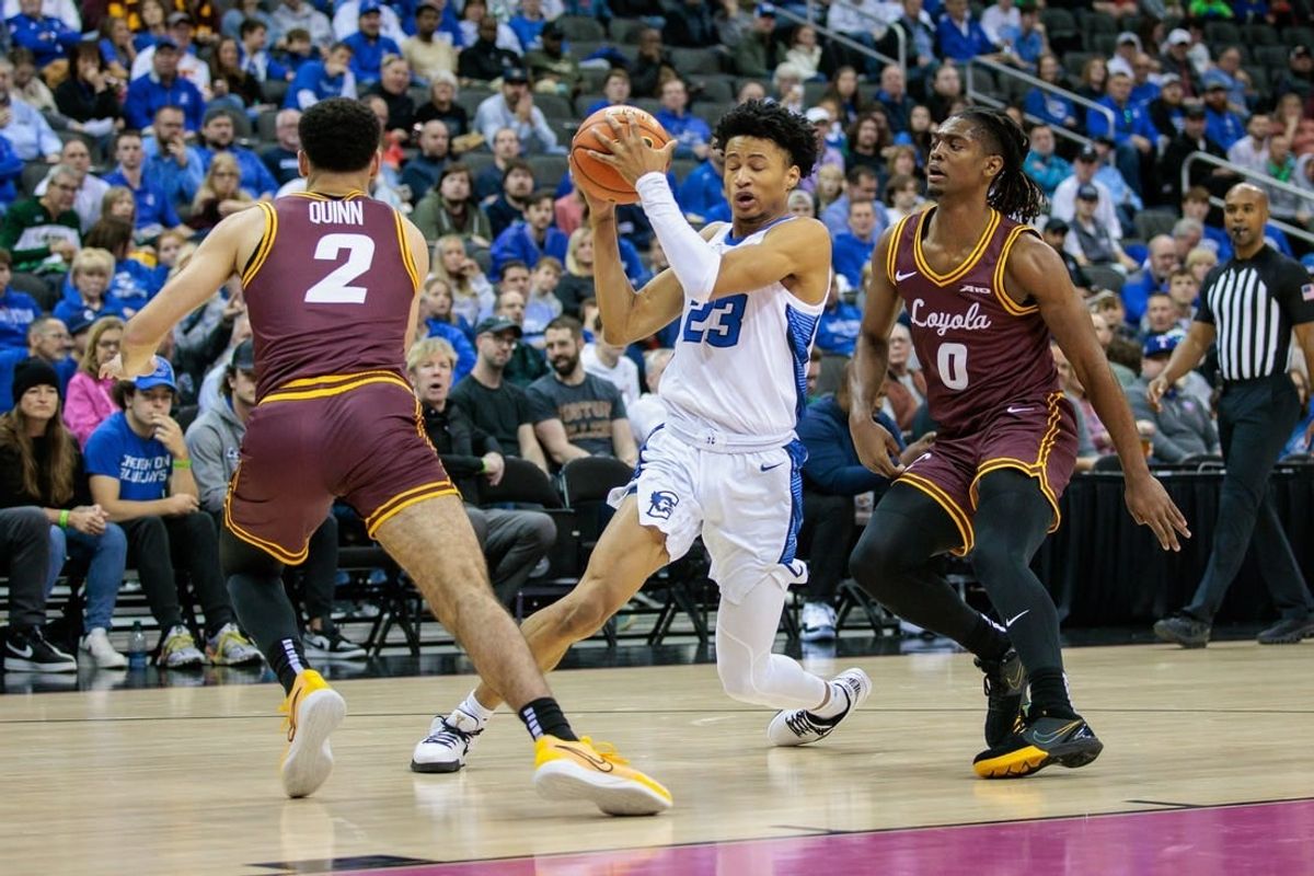 Nov 22, 2023; Kansas City, Missouri, USA; Creighton Bluejays guard Trey Alexander (23) looks for an opening during the first half between Loyola (Il) Ramblers guard Jalen Quinn (2) and Loyola (Il) Ramblers guard Desmond Watson (0) at T-Mobile Center.