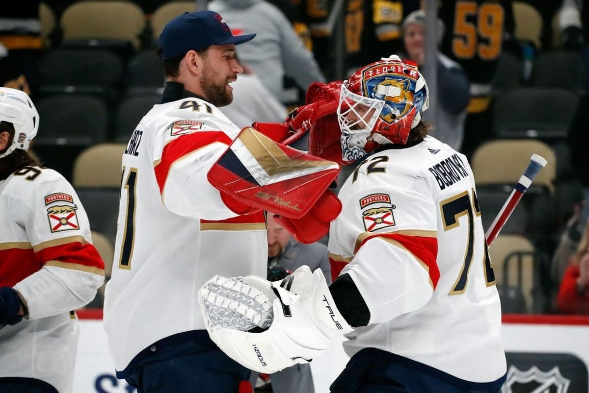 Feb 14, 2024; Pittsburgh, Pennsylvania, USA;  Florida Panthers goaltenders Anthony Stolarz (41) and Sergei Bobrovsky (72) celebrate after defeating the Pittsburgh Penguins at PPG Paints Arena.
