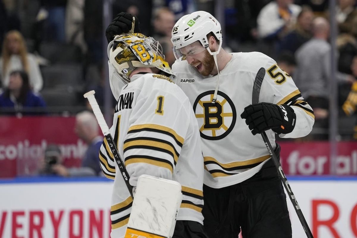 Mar 4, 2024; Toronto, Ontario, CAN; Boston Bruins goaltender Jeremy Swayman (1) and forward Justin Brazeau (55) celebrate a win over the Toronto Maple Leafs at Scotiabank Arena.