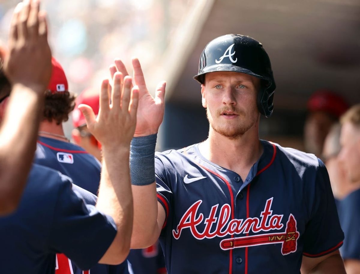 Mar 10, 2024; Tampa, Florida, USA;Atlanta Braves catcher Sean Murphy (12) is congratulated in the dugout after he scored during the first inning against the New York Yankees at George M. Steinbrenner Field.