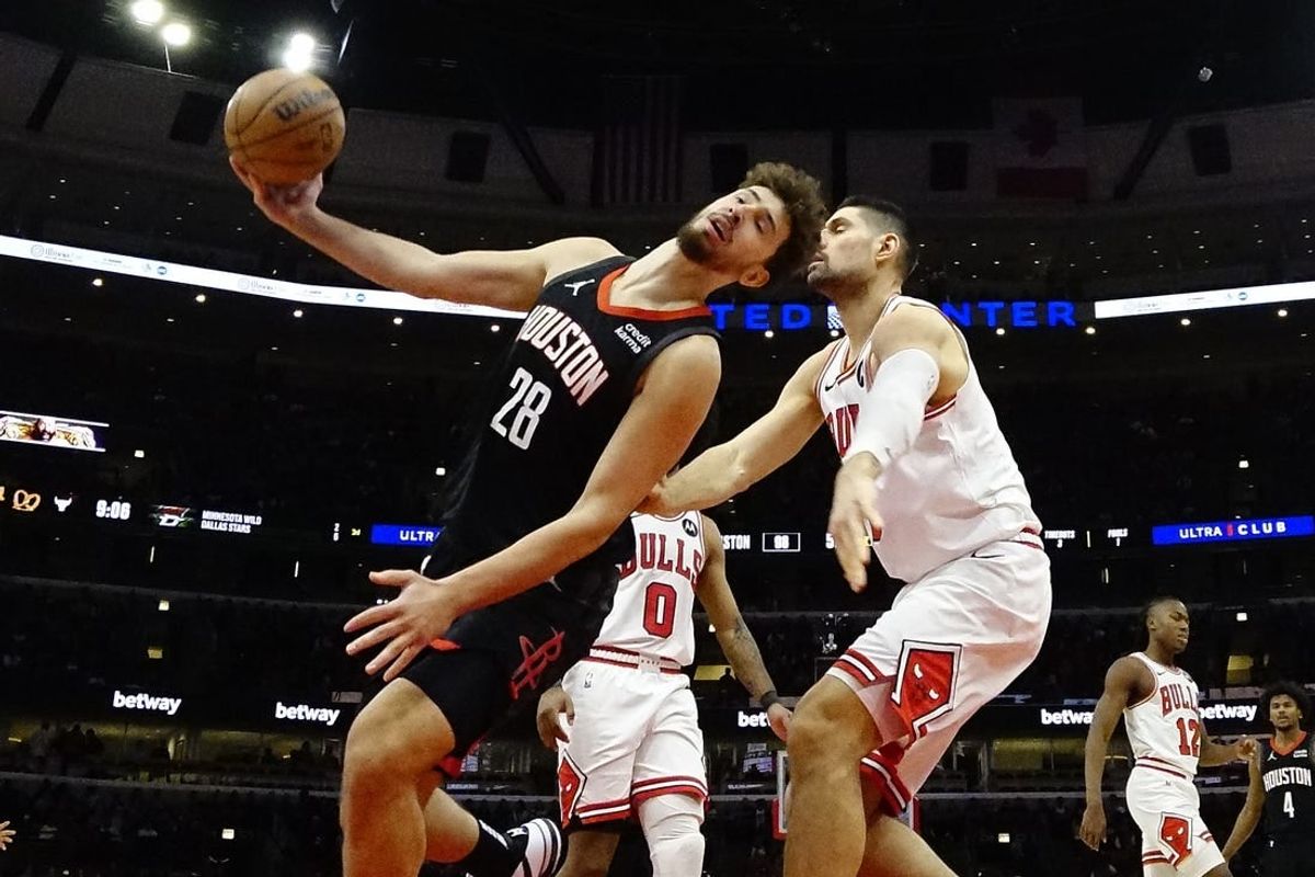 Jan 10, 2024; Chicago, Illinois, USA; Chicago Bulls center Nikola Vucevic (9) fouls Houston Rockets center Alperen Sengun (28) during the second half at United Center.