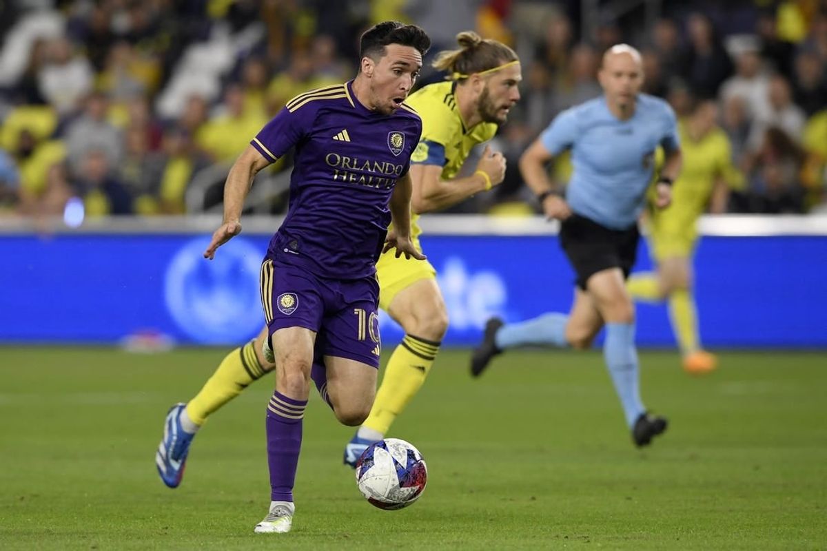 Nov 7, 2023; Nashville, Tennessee, USA; Orlando City midfielder Mauricio Pereyra (10) controls the ball against the Nashville SC in the first half at Geodis Park.