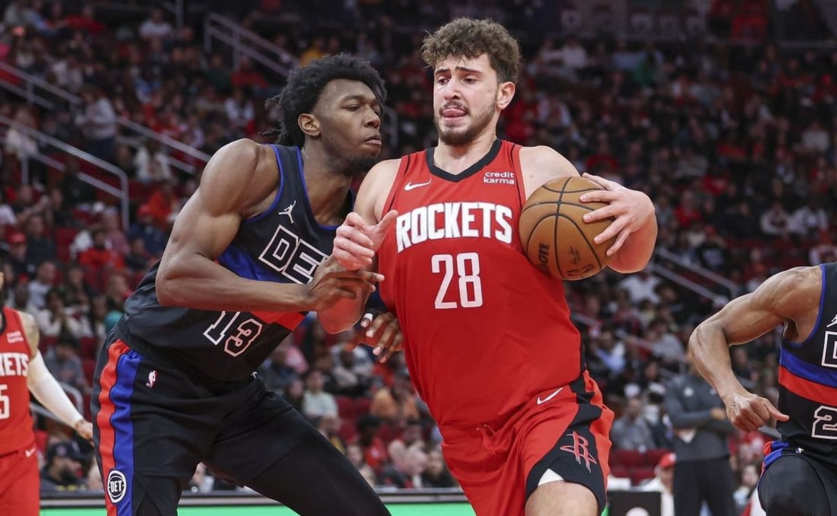 Jan 1, 2024; Houston, Texas, USA; Houston Rockets center Alperen Sengun (28) controls the ball as Detroit Pistons center James Wiseman (13) defends during the game at Toyota Center.