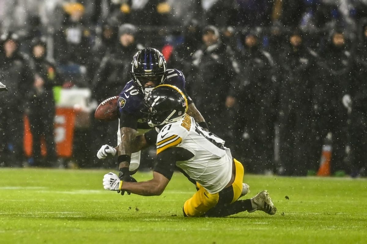 Jan 6, 2024; Baltimore, Maryland, USA;  Baltimore Ravens cornerback Arthur Maulet (10) breaks up a pass intended for Pittsburgh Steelers wide receiver Allen Robinson II (11) during the first quarter at M&T Bank Stadium.