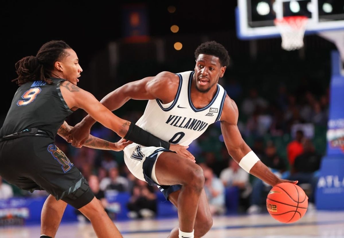 Nov 24, 2023; Paradise Island, BAHAMAS;  Villanova Wildcats guard TJ Bamba (0) controls the ball as Memphis Tigers guard Caleb Mills (9) defends during the first half at Imperial Arena.