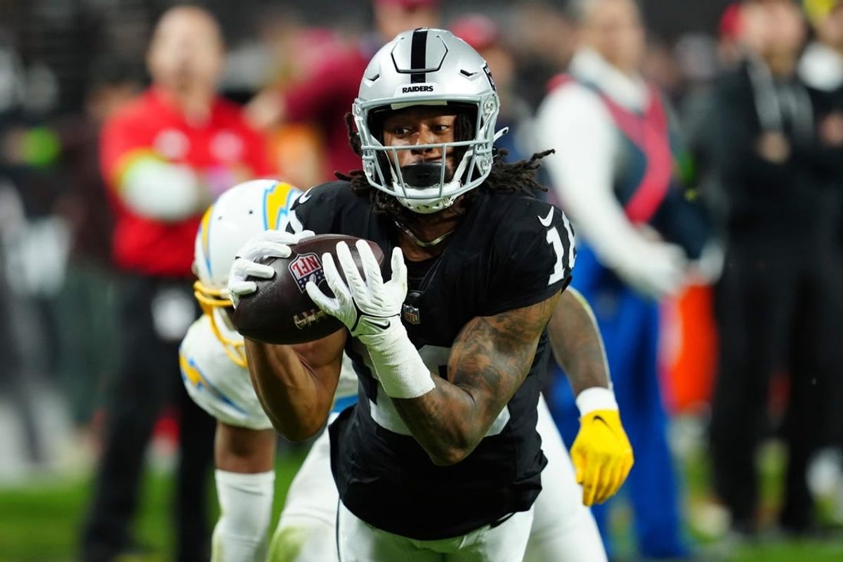 Dec 14, 2023; Paradise, Nevada, USA;  Las Vegas Raiders wide receiver Jakobi Meyers (16) makes a catch for a touchdown against the Los Angeles Chargers in the first quarter at Allegiant Stadium.