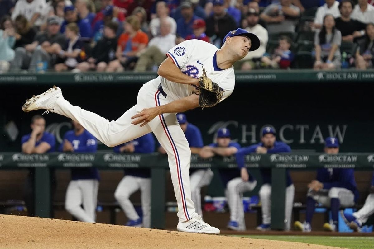 Apr 6, 2024; Arlington, Texas, USA;  Texas Rangers pitcher Brock Burke (46) throws to the plate during the fourth inning against the Houston Astros at Globe Life Field.