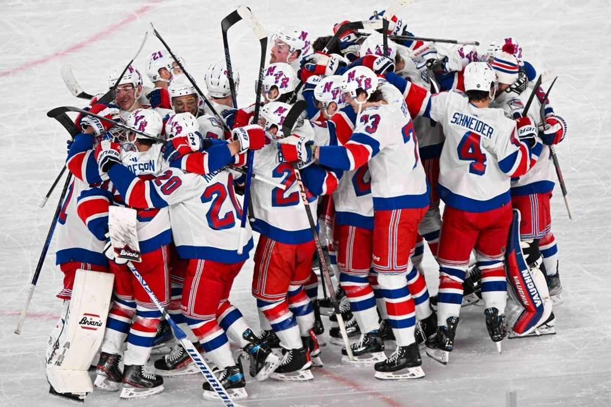 Feb 18, 2024; East Rutherford, New Jersey, USA;  The New York Rangers  celebrate the 6-5 victory over the the New York Islanders  after the game in a Stadium Series ice hockey game at MetLife Stadium.