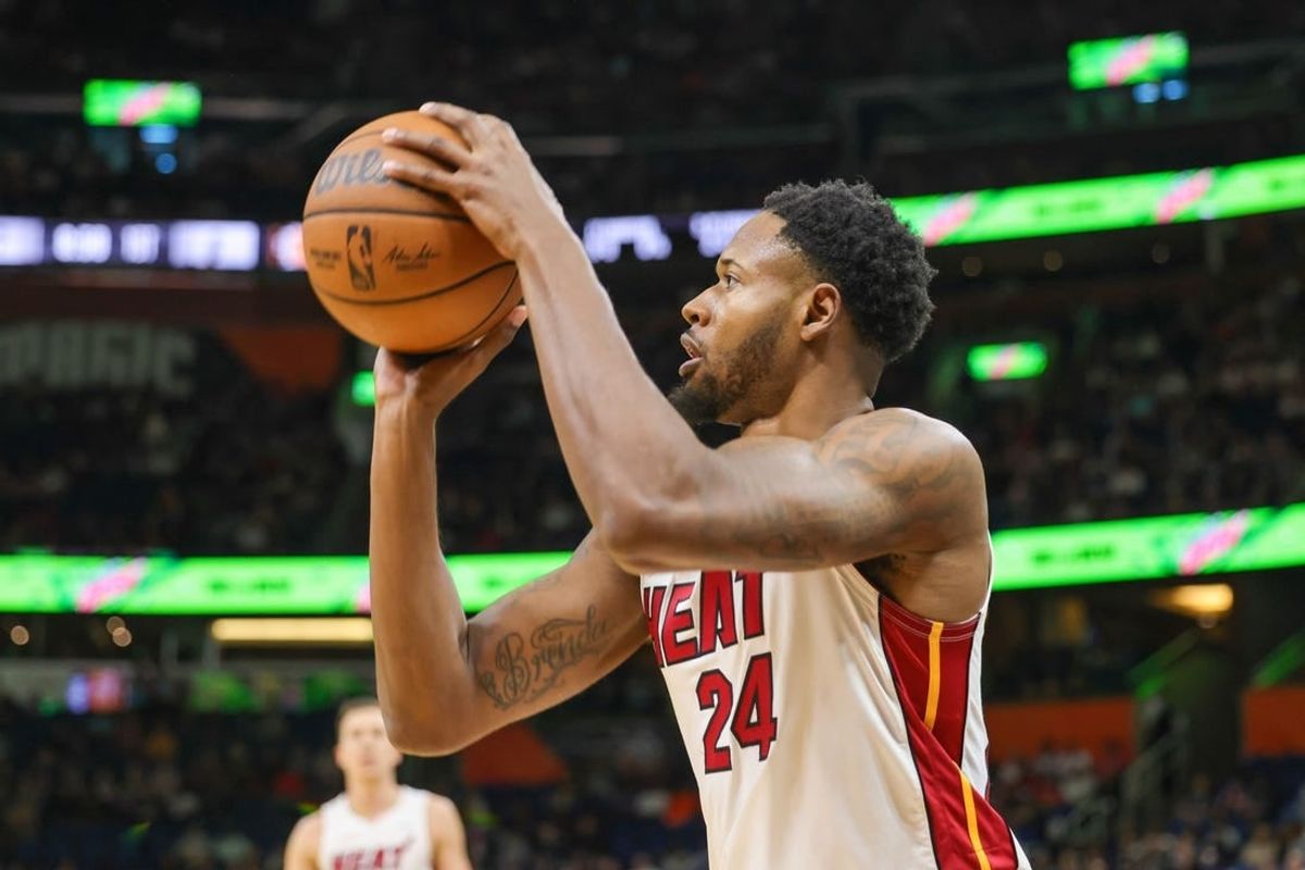 Apr 10, 2022; Orlando, Florida, USA; Miami Heat forward Haywood Highsmith (24) shoots a three-point basket against the Orlando Magic during the first quarter at Amway Center.