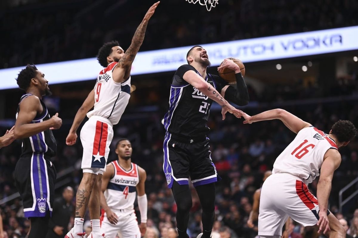 Mar 21, 2024; Washington, District of Columbia, USA;  a21 reacts after being fouled by Washington Wizards forward Anthony Gill (16) during the first half at Capital One Arena.