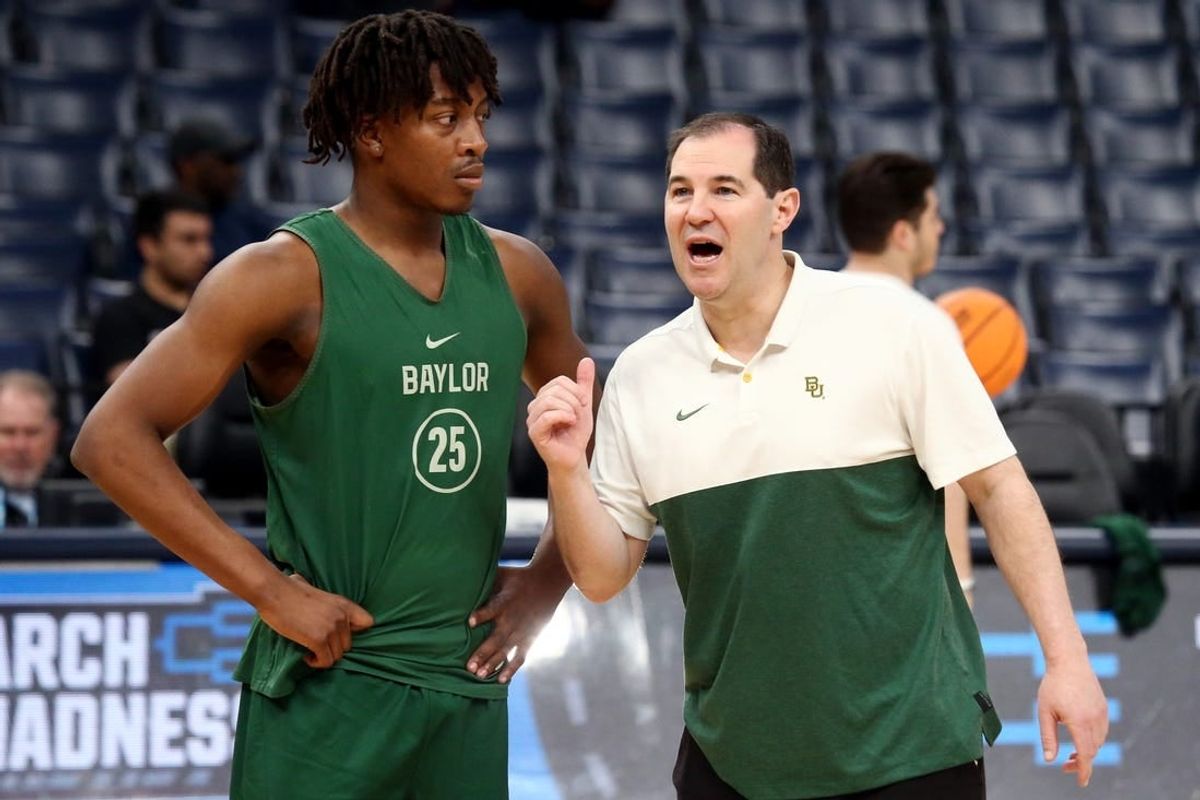 Mar 21, 2024; Memphis, TN, USA; Baylor Bears head coach Scott Drew (right) talks with guard Omar Adegbola (25) during practice for the NCAA Tournament First Round at FedExForum.