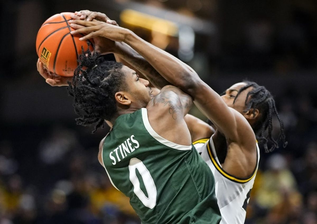 Nov 25, 2023; Columbia, Missouri, USA; Missouri Tigers forward Aidan Shaw (23) blocks the shot of Loyola (Md) Greyhounds guard D'Angelo Stines (0) during the first half at Mizzou Arena.