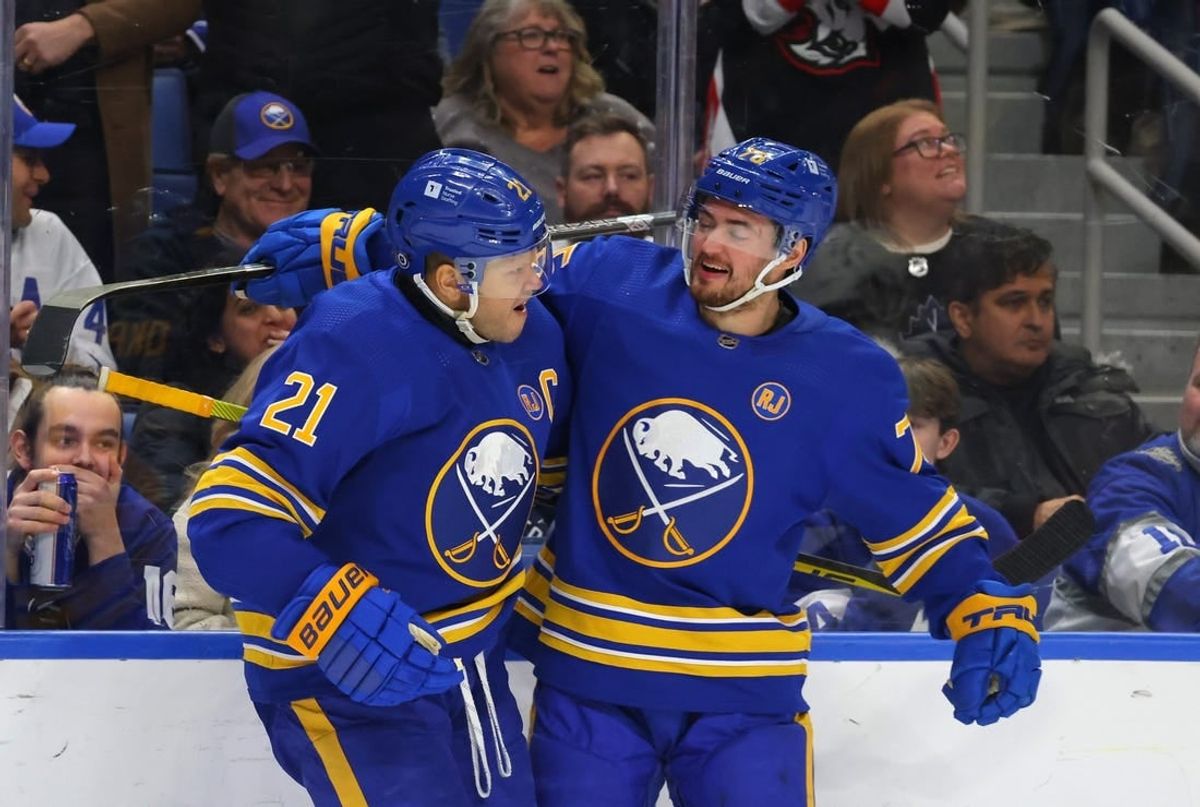 Dec 21, 2023; Buffalo, New York, USA;  Buffalo Sabres right wing Kyle Okposo (21) celebrates his shorthanded goal with defenseman Connor Clifton (75) during the second period against the Toronto Maple Leafs at KeyBank Center.