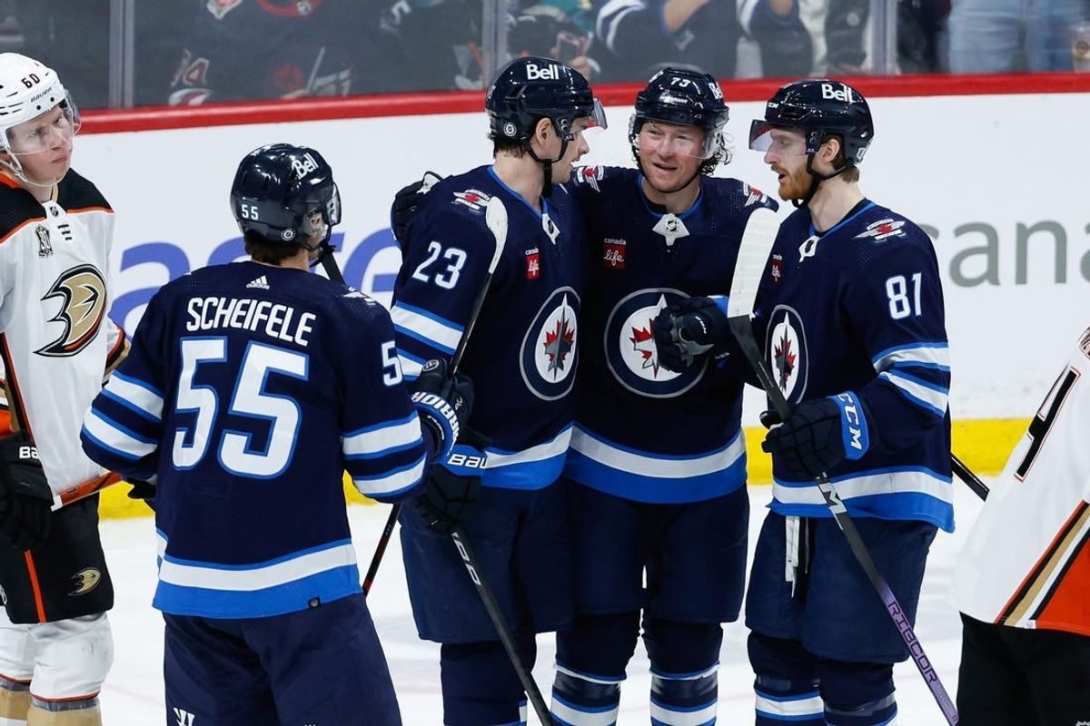 Mar 15, 2024; Winnipeg, Manitoba, CAN; Winnipeg Jets forward Tyler T0ffoli (73) is congratulated by his team mates on his goal against the Anaheim Ducks during the third period at Canada Life Centre.