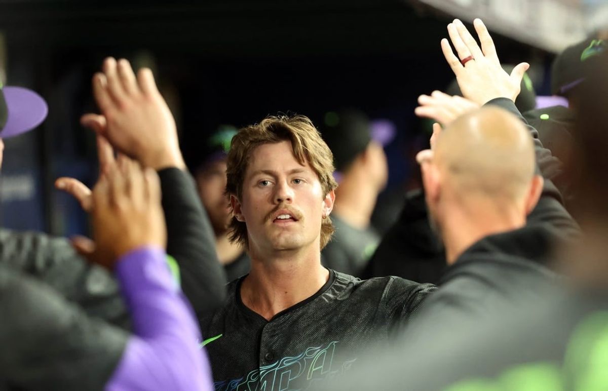 May 3, 2024; St. Petersburg, Florida, USA; Tampa Bay Rays outfielder Jonny DeLuca (21) is congratulated in the dugout after he scored a run against the New York Metsnduring the third inning at Tropicana Field.