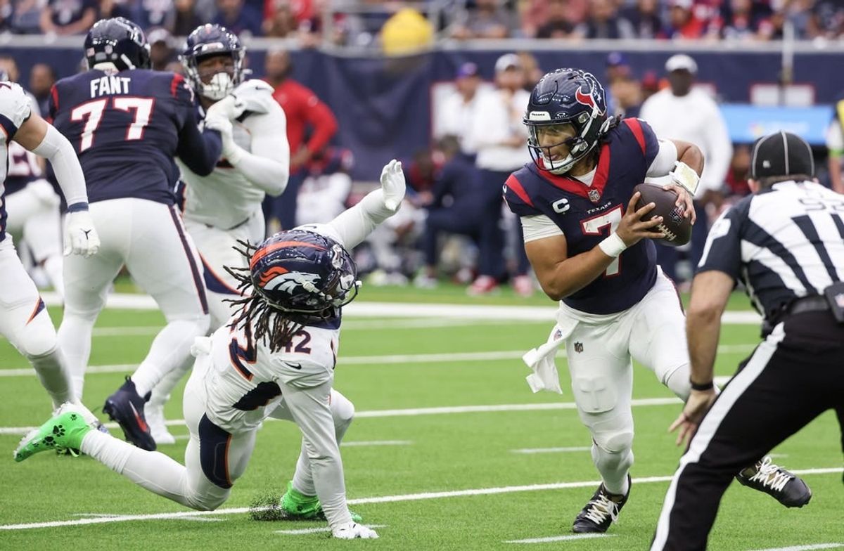 Dec 3, 2023; Houston, Texas, USA; Houston Texans quarterback C.J. Stroud (7) scrambles from Denver Broncos linebacker Nik Bonitto (42) in the second quarter at NRG Stadium.