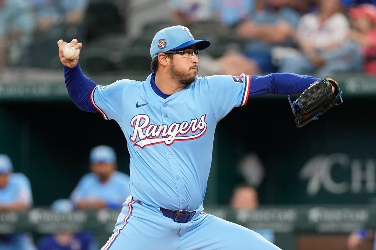 Apr 28, 2024; Arlington, Texas, USA; Texas Rangers starting pitcher Dane Dunning (33) delivers a pitch to the Cincinnati Reds during the first inning at Globe Life Field.