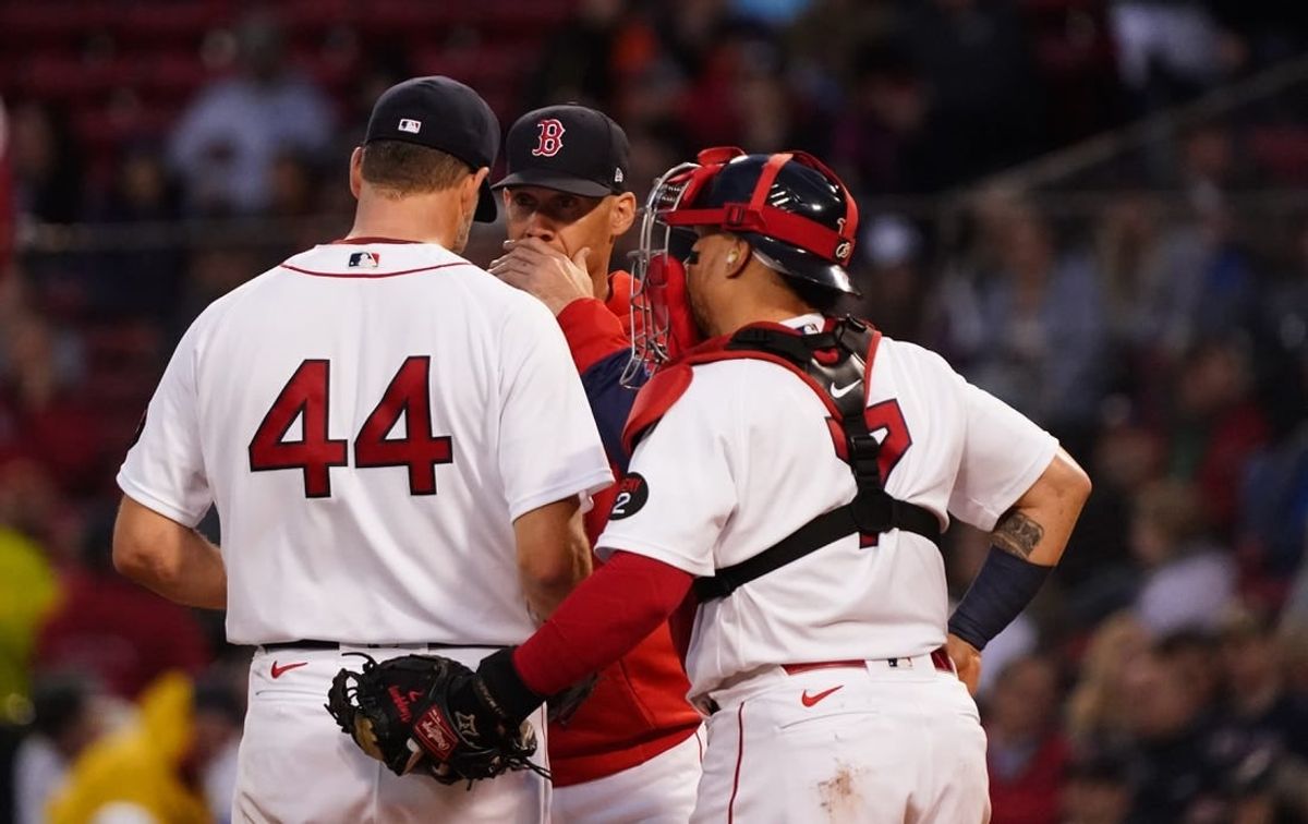 May 19, 2022; Boston, Massachusetts, USA; Boston Red Sox pitching coach Dave Bush (58) talks with starting pitcher Rich Hill (44) against the Seattle Mariners in the second inning at Fenway Park.